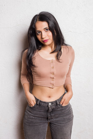 Beige cropped full-sleeve top in soft viscose with button-up front and high-low hem.