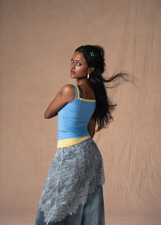 Model wearing the sky-blue Lemon Sky Double Scoop Tank with yellow contrast binding