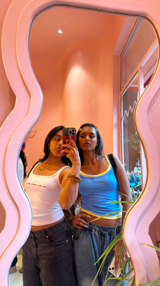 Girls wearing the sky-blue Lemon Sky Double Scoop Tank with butter yellow contrast binding