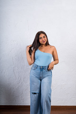 Side angle of the Sterling Blue one-shoulder bodysuit, highlighting its flattering fit and seamless design.
