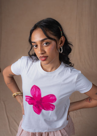 Close-up of hand-painted floral graphic on Pink Bloom tee