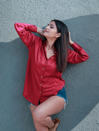 Side profile of the oversized red Boyfriend Shirt showing relaxed fit and soft drape of viscose fabric.