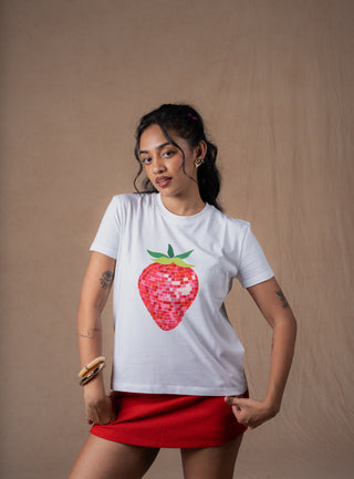 Close-up of colorful disco-inspired strawberry graphic on white tee
