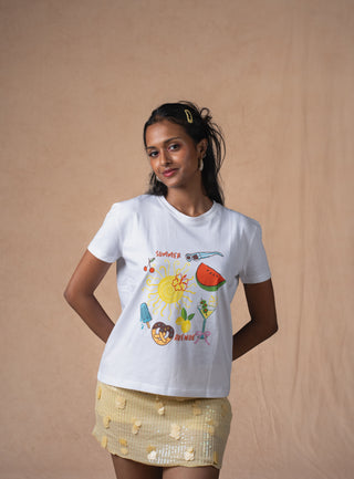Close-up of sunshine, floral and fruit artwork on Summer Avenue tee