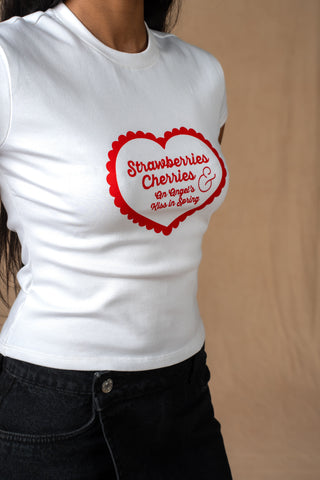 Close-up of Strawberries Cherries & Vines graphic on white tee