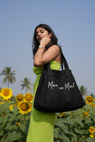 Nimade black tote bag with 'Mamma Mia' print, crafted from 100% organic canvas, perfect for everyday use.