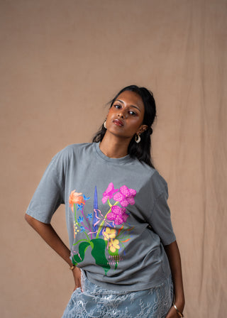 Close-up of hand-painted botanical artwork on Wildflower oversized tee