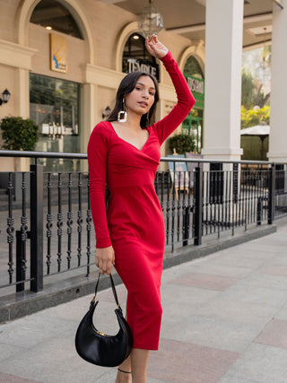Detailed view of Amour Midi dress with a wide surplice neckline and smooth viscose fabric.
