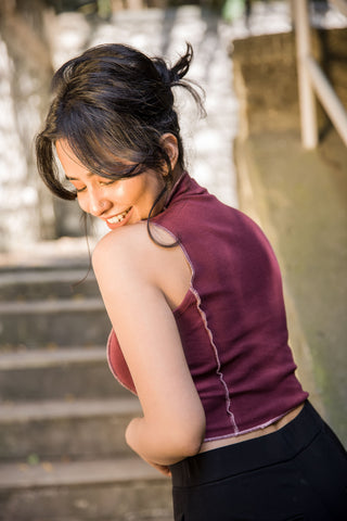 Side profile of Windsor Wine Top, showing its cropped length and sleeveless cut.